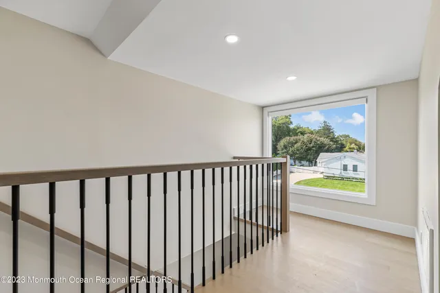 a view of an empty room and a window