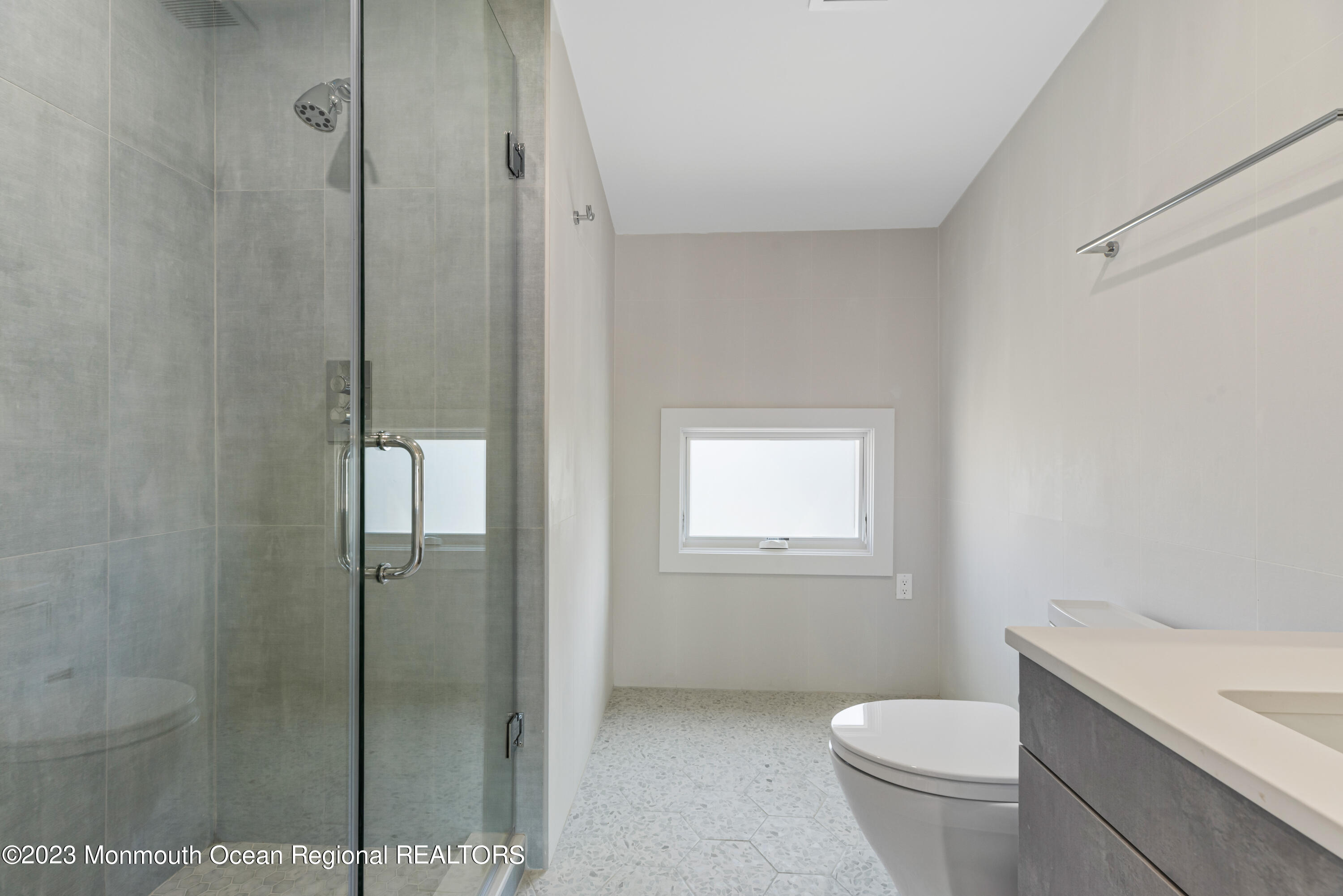 929 Van Ct Avenue Long Branch, NJ 07740 - Photo 29 of 37 a bathroom with a granite countertop sink toilet and shower