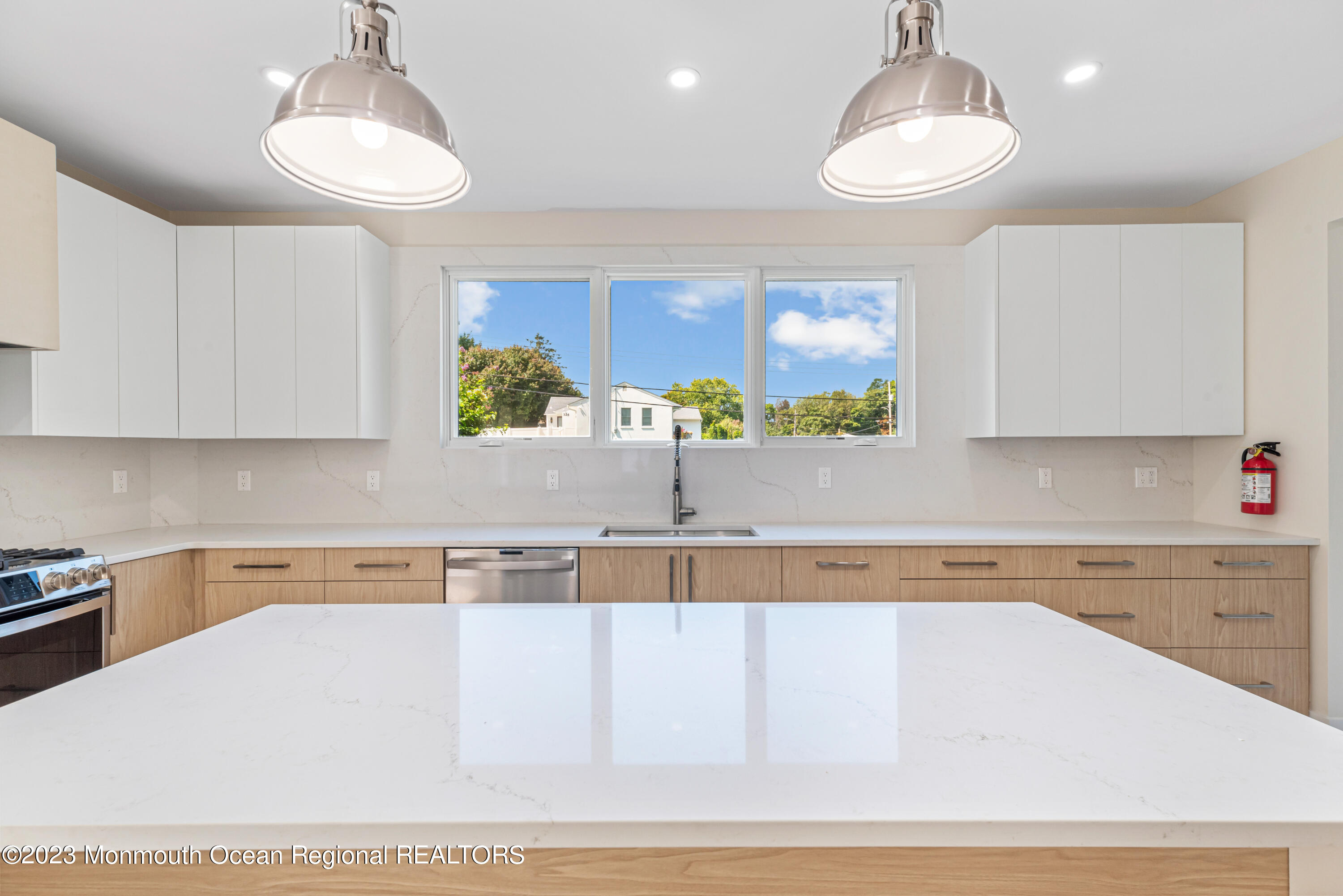 929 Van Ct Avenue Long Branch, NJ 07740 - Photo 8 of 37 a kitchen with a sink a counter top space appliances and cabinets