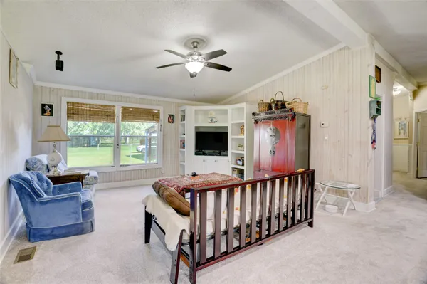 a bedroom with furniture and windows