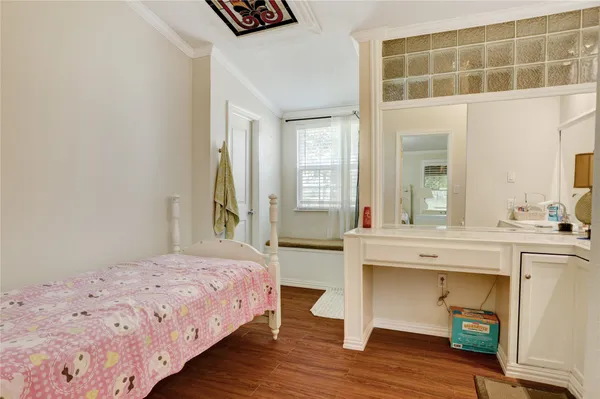 a spacious bedroom with a bed and a table in it