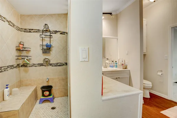 a bathroom with a sink vanity and mirror