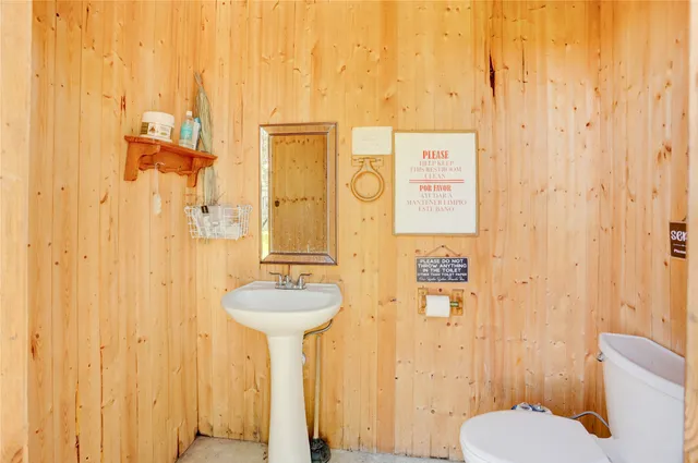 a bathroom with a sink and toilet