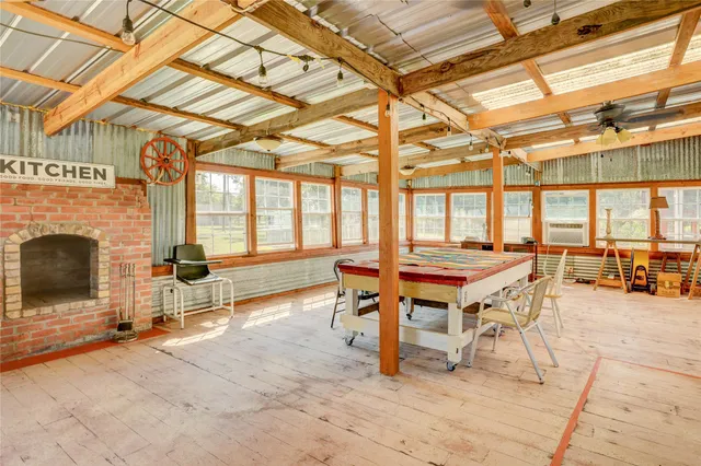 a outdoor space with lots of furniture and a fireplace