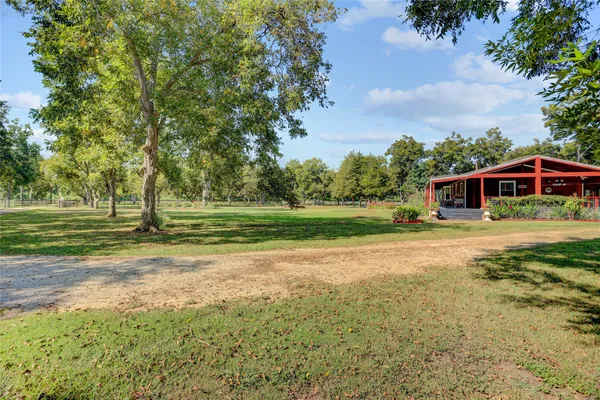 a view of a house with a big yard