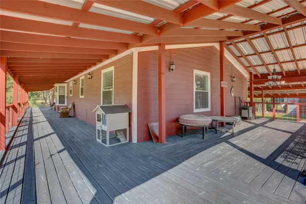 a outdoor space with lots of furniture and wooden floor