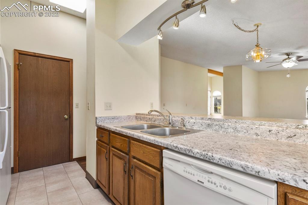 1130 Fontmore Road, Unit C Colorado Springs, CO 80904 - Photo 14 of 27 a bathroom with a sink and a mirror