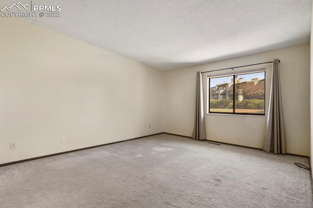 1130 Fontmore Road, Unit C Colorado Springs, CO 80904 - Photo 22 of 27 an empty room with sliding door