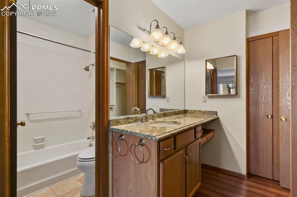 1130 Fontmore Road, Unit C Colorado Springs, CO 80904 - Photo 24 of 27 a bathroom with a sink a vanity and a mirror