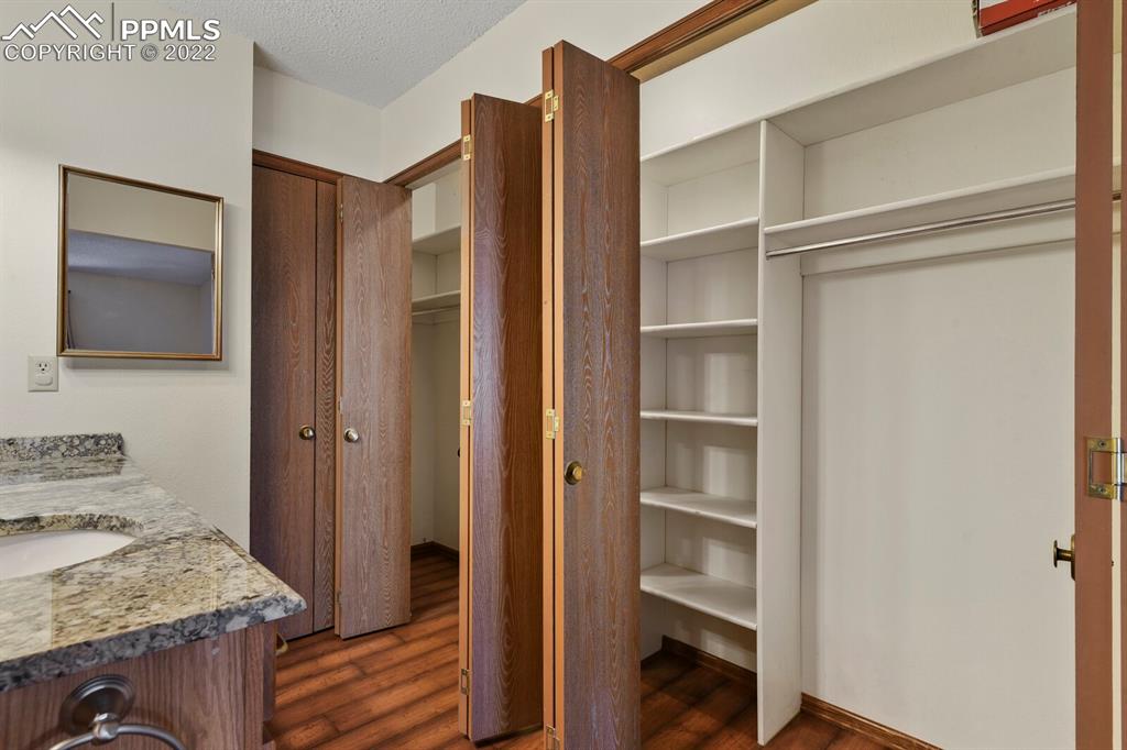 1130 Fontmore Road, Unit C Colorado Springs, CO 80904 - Photo 25 of 27 a view of an empty room with wooden floor and closet