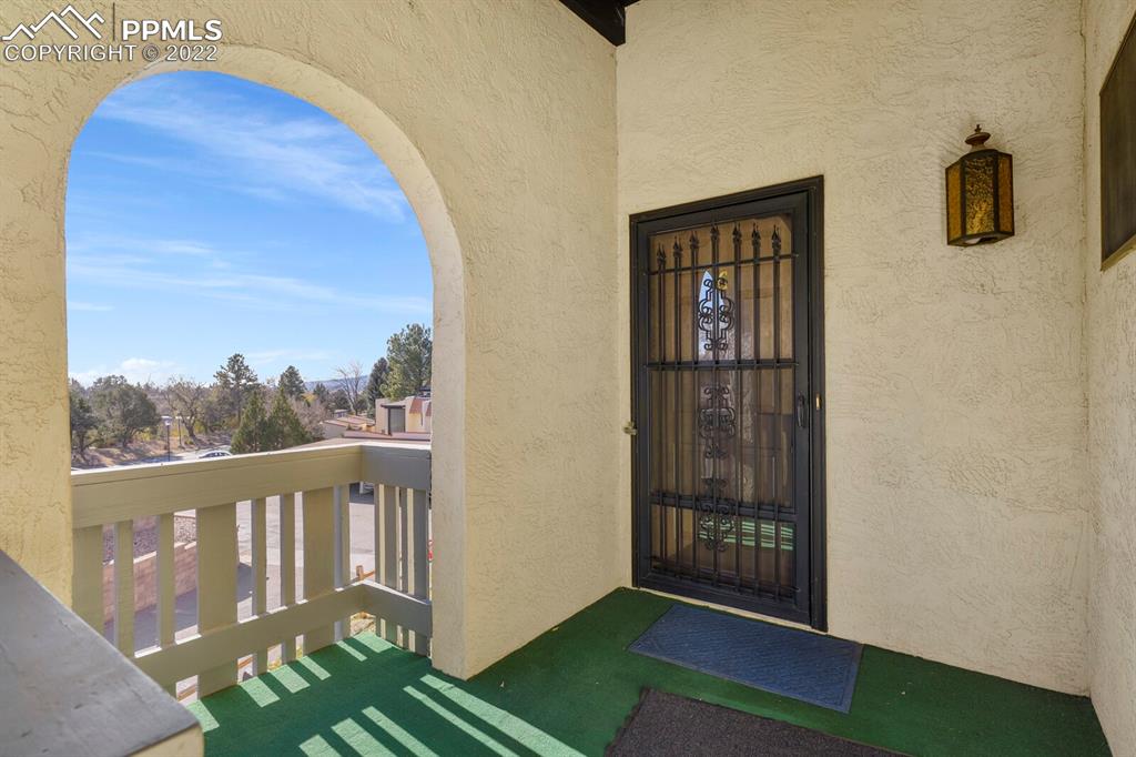 1130 Fontmore Road, Unit C Colorado Springs, CO 80904 - Photo 4 of 27 a view of a balcony and front door