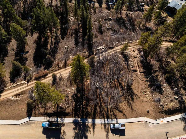 a view of a sign board with a small yard