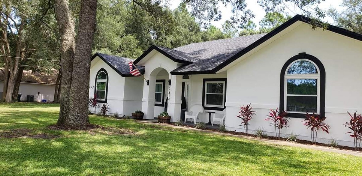 96414 Chester Road Yulee, FL 32097 - Photo 1 of 13 a front view of house with yard