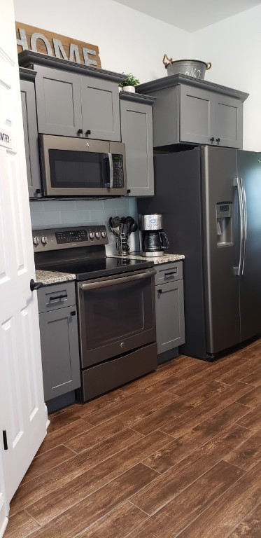 96414 Chester Road Yulee, FL 32097 - Photo 13 of 13 a kitchen with stainless steel appliances granite countertop a stove a refrigerator and a microwave