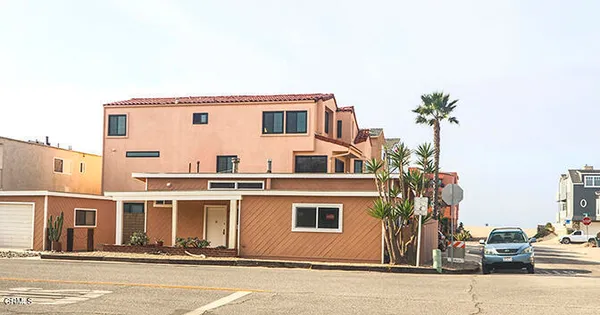 a view of a house with a street