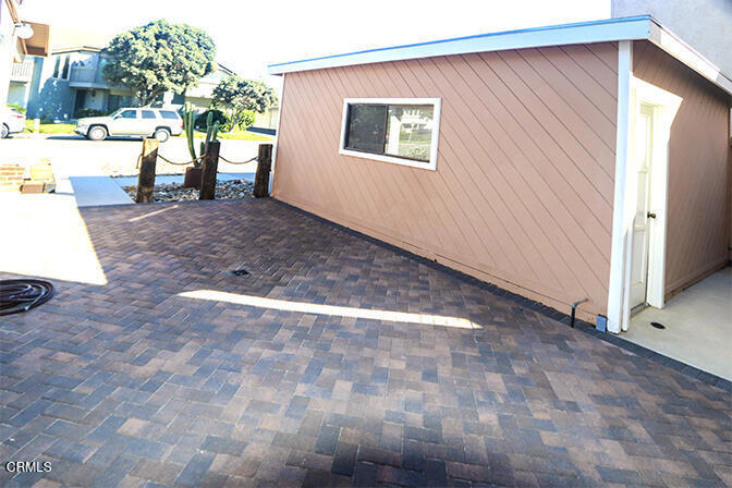 3661 Sunset Lane Oxnard, CA 93035 - Photo 4 of 14 a view of backyard with a large tree