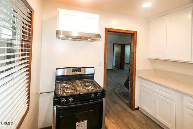 a kitchen with a stove and a microwave