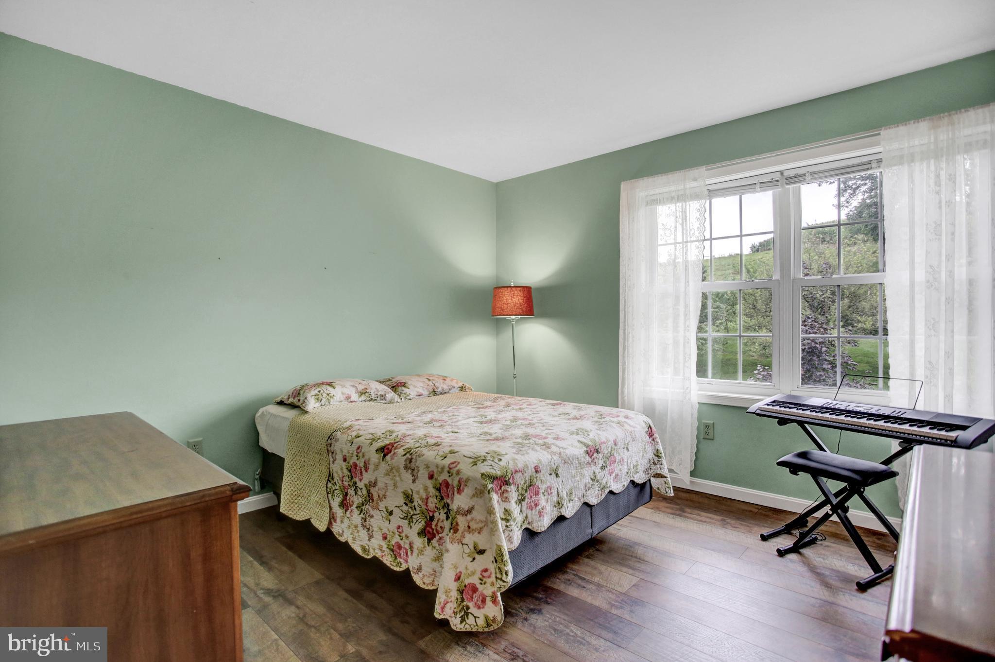 765 Habecker Church Road Washington Boro, PA 17582 - Photo 24 of 29 a bedroom with a bed and a desk
