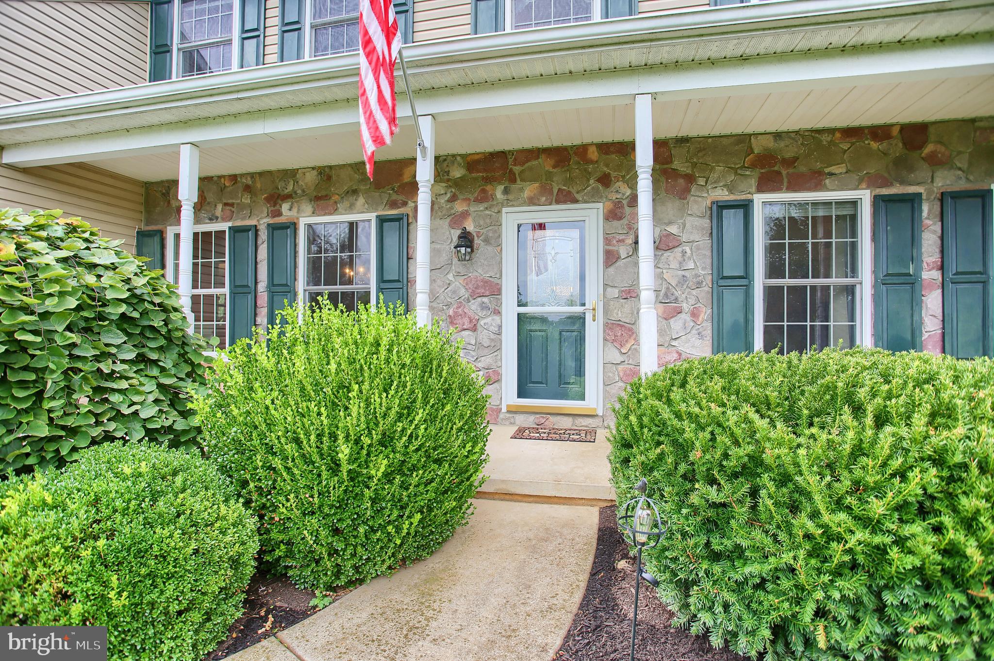 765 Habecker Church Road Washington Boro, PA 17582 - Photo 3 of 29 a front view of a house with a yard and flowers