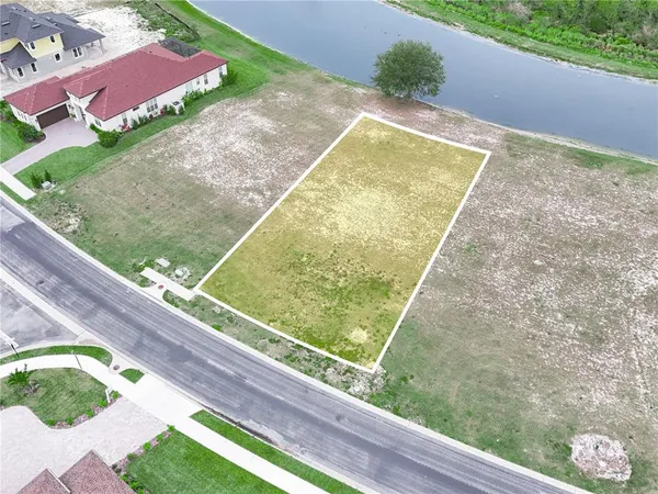 a view of a pool and a yard