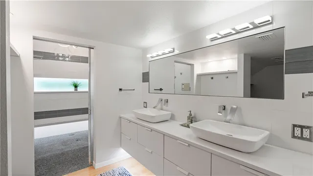a bathroom with a white bath tub and a shower