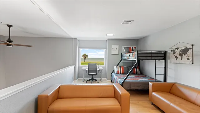 a bedroom with bed and a flat screen tv