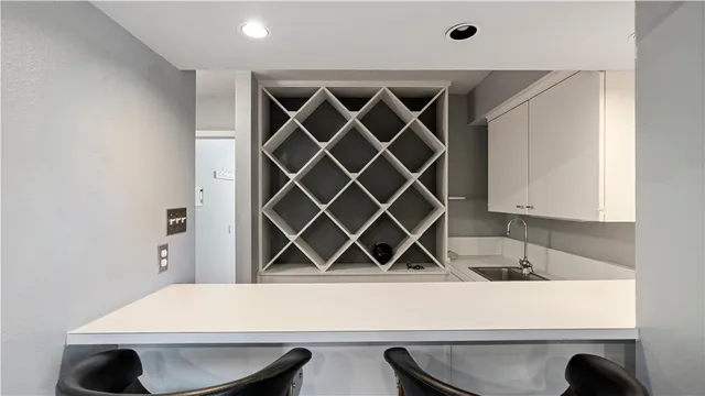 a living room with furniture a dining table and chairs