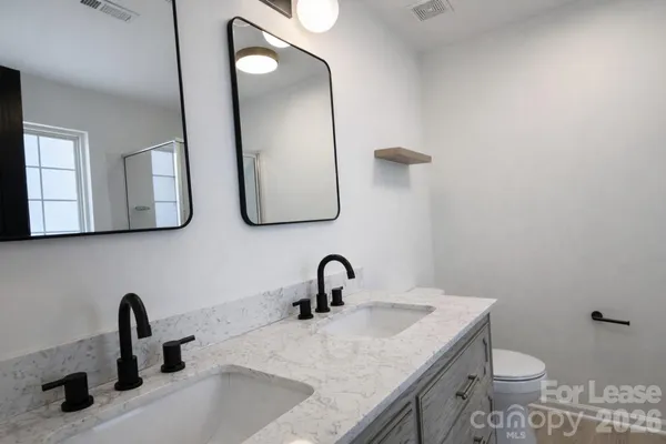 a bathroom with a sink and a toilet