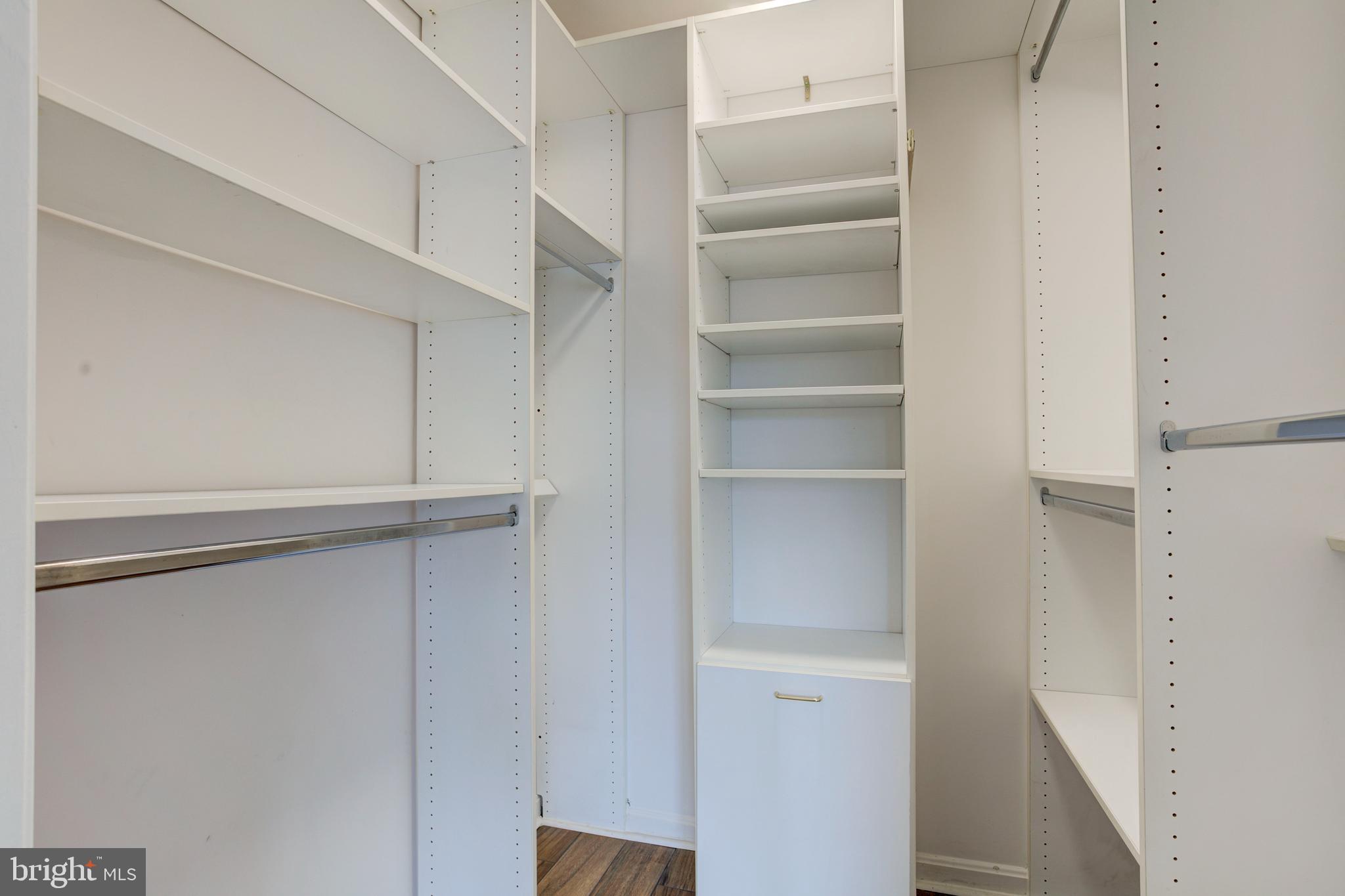 14174 Cuddy Loop, Unit 204 Woodbridge, VA 22193 - Photo 16 of 24 a view of walk in closet with empty racks