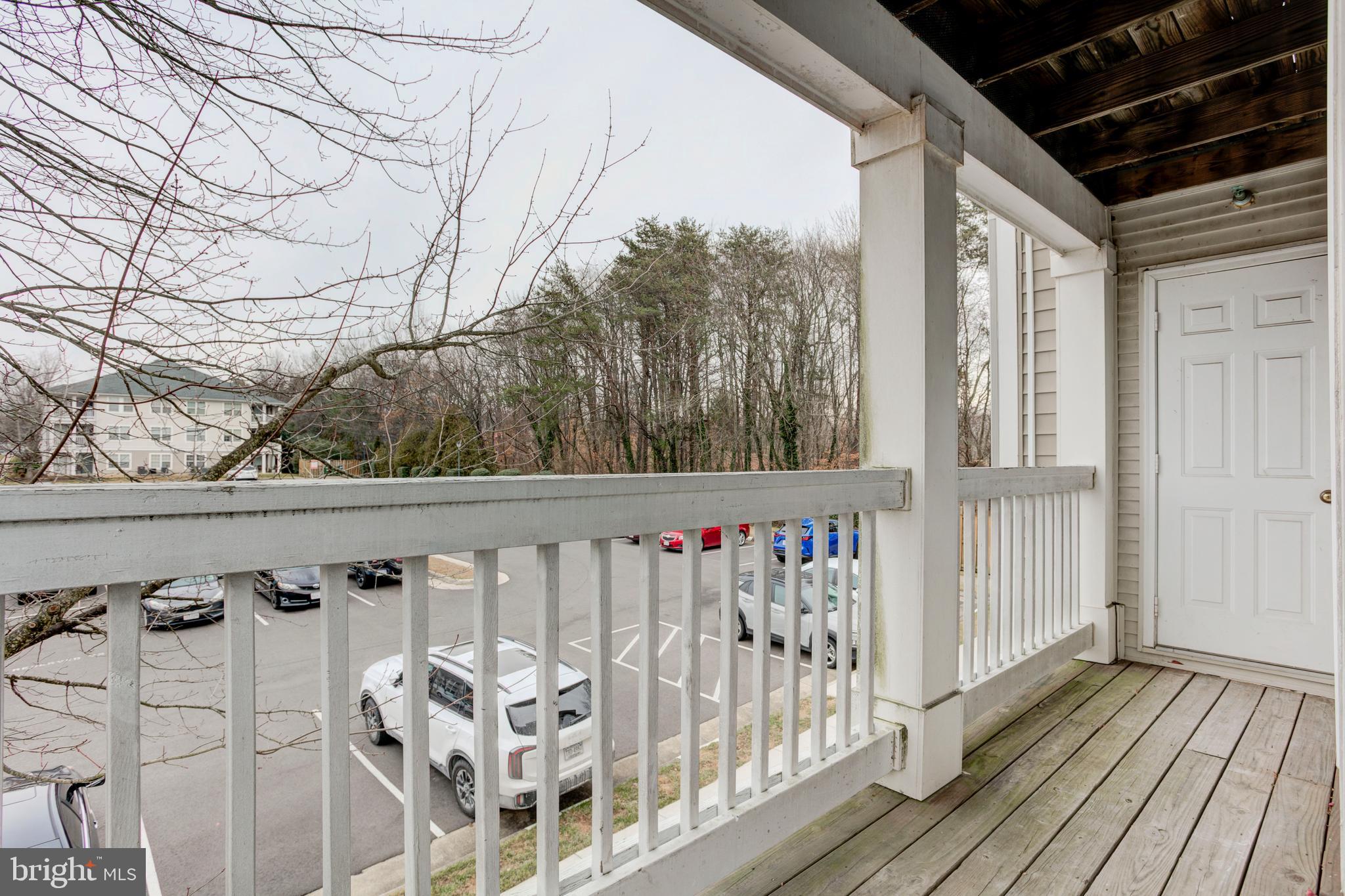 14174 Cuddy Loop, Unit 204 Woodbridge, VA 22193 - Photo 24 of 24 a view of a balcony with wooden floor
