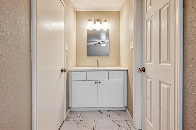 a bathroom with a sink a toilet and bathtub