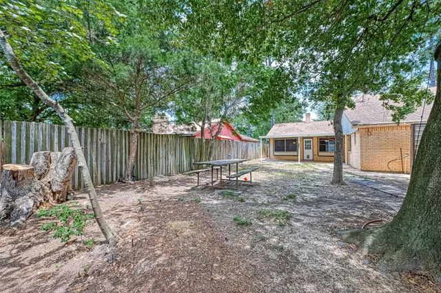 a view of a house with a yard and stairs