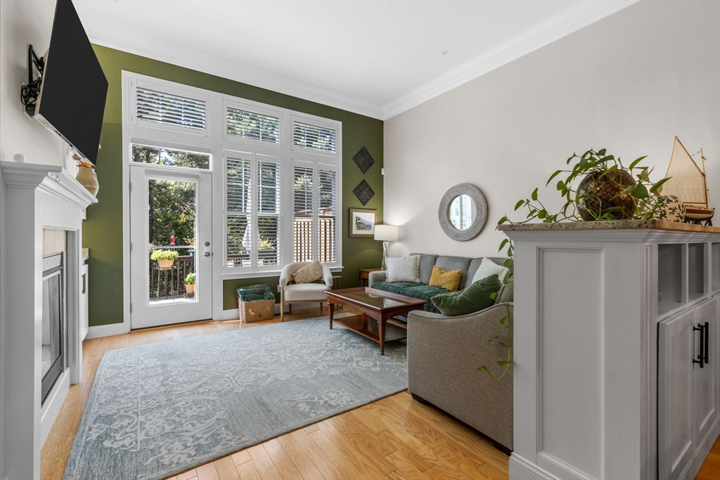 116 Grey Hawk Drive, Unit 116 Mashpee, MA 02649 - Photo 14 of 41 a living room with furniture and a fireplace