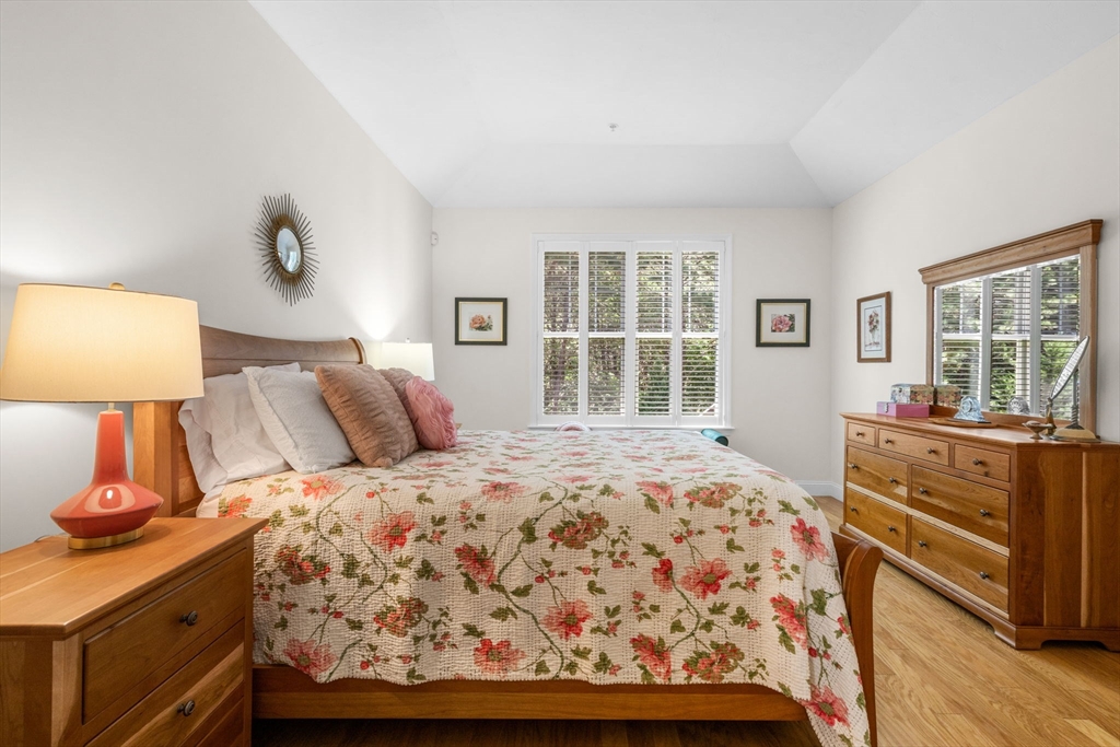 116 Grey Hawk Drive, Unit 116 Mashpee, MA 02649 - Photo 20 of 41 a bedroom with a bed and a window