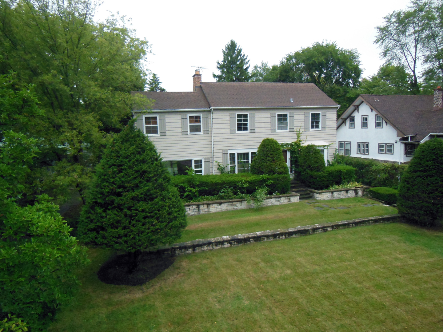 216 Blackhawk Road Riverside, IL 60546 - Photo 2 of 27 a front view of a house with garden