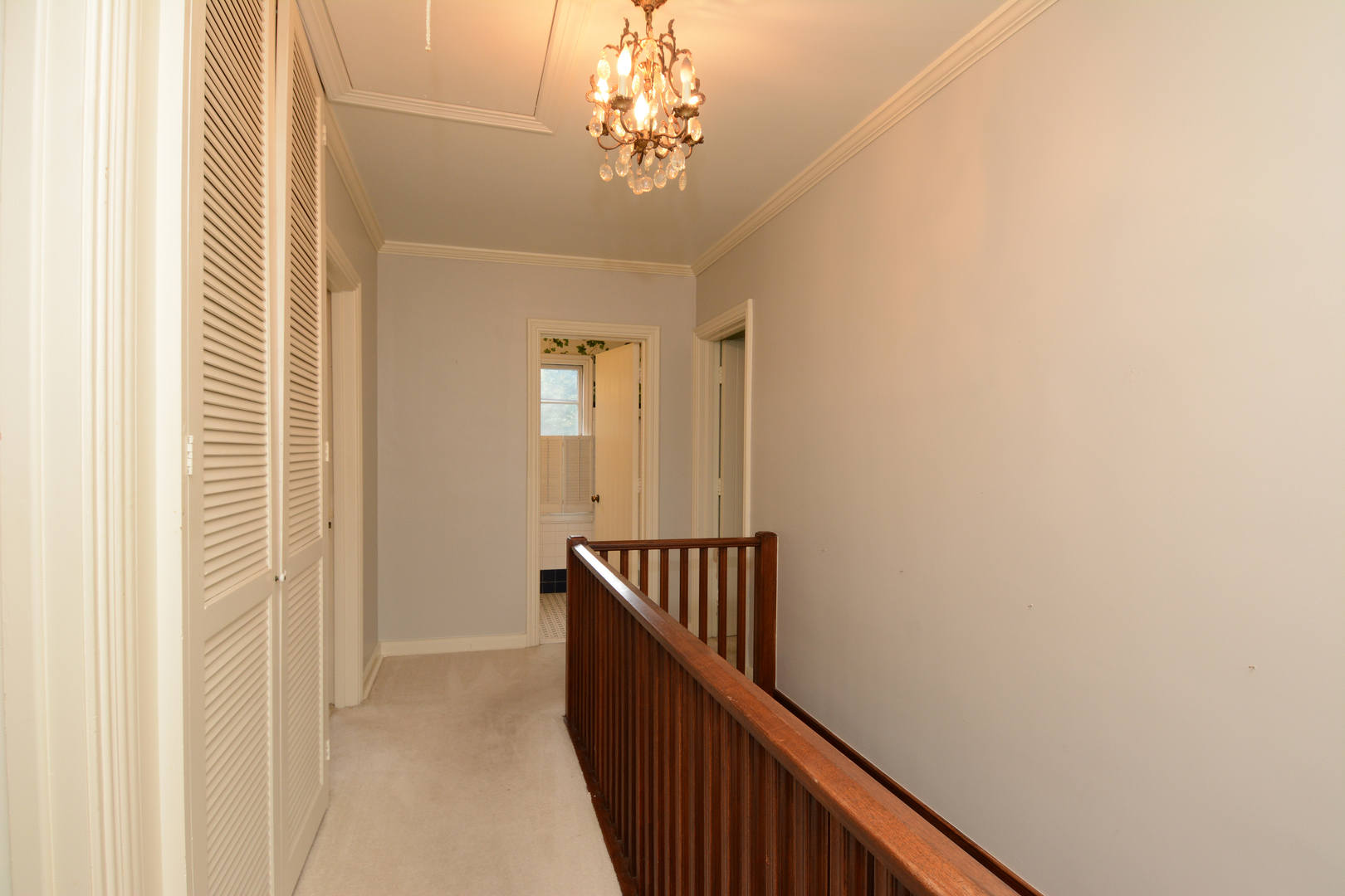 216 Blackhawk Road Riverside, IL 60546 - Photo 11 of 27 a view of a hallway with wooden floor and staircase