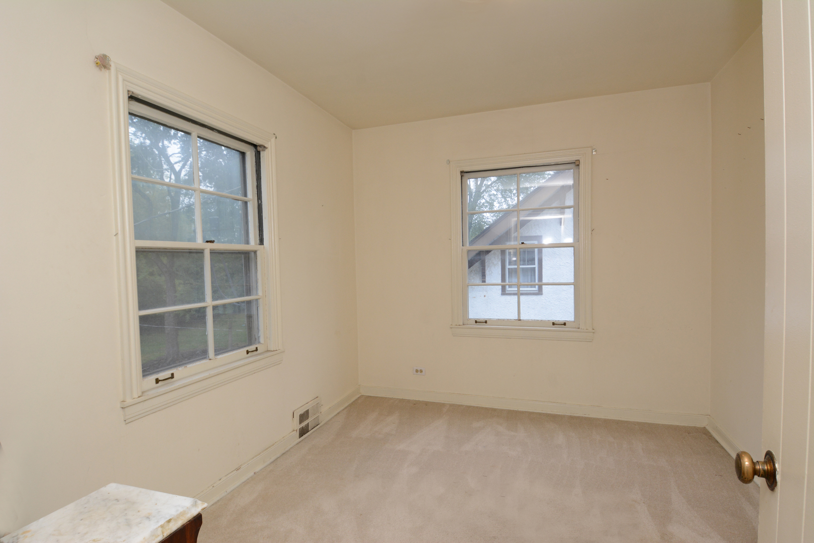 216 Blackhawk Road Riverside, IL 60546 - Photo 12 of 27 a view of an empty room with a window