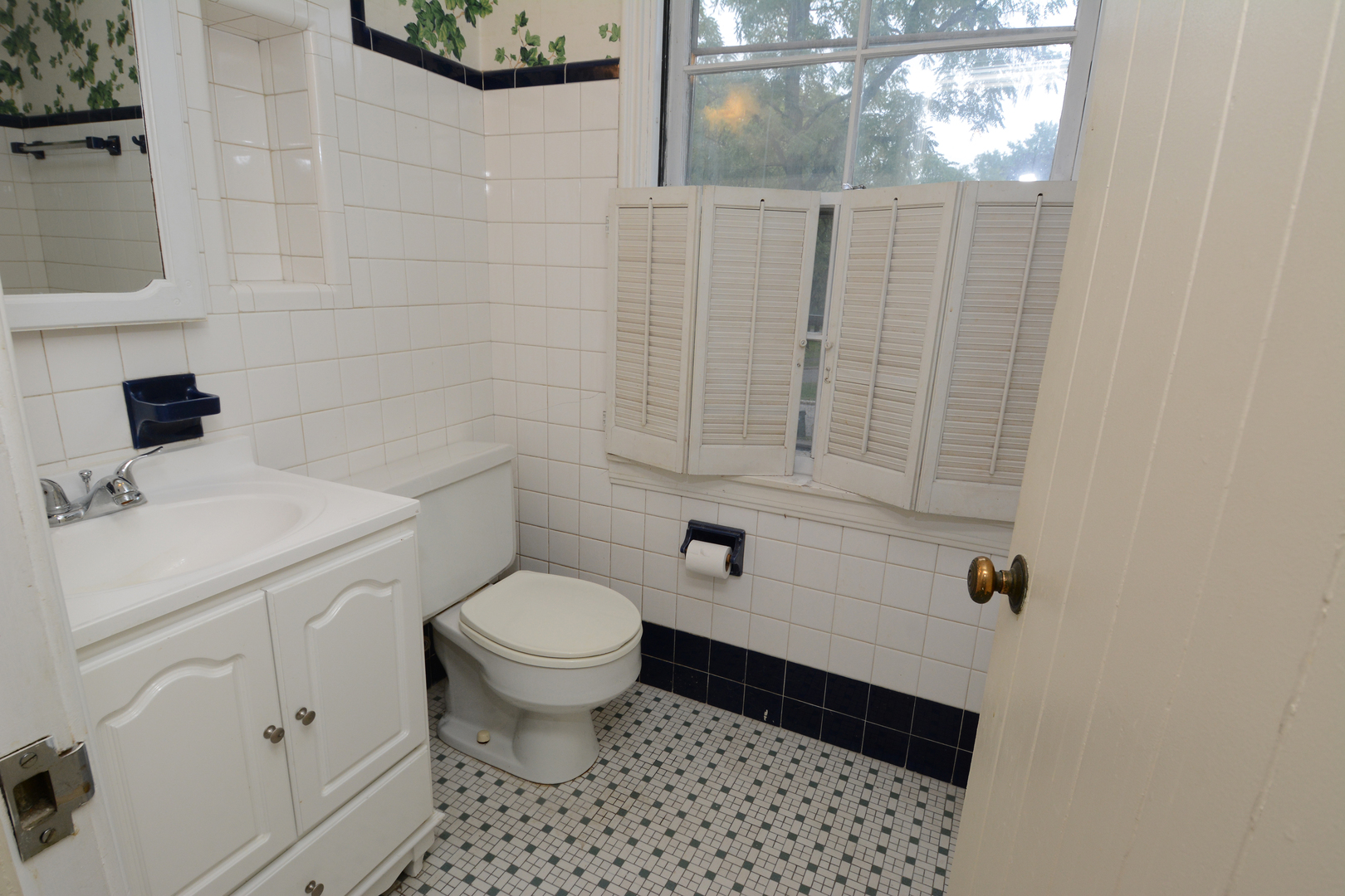216 Blackhawk Road Riverside, IL 60546 - Photo 14 of 27 a bathroom with a sink toilet and window