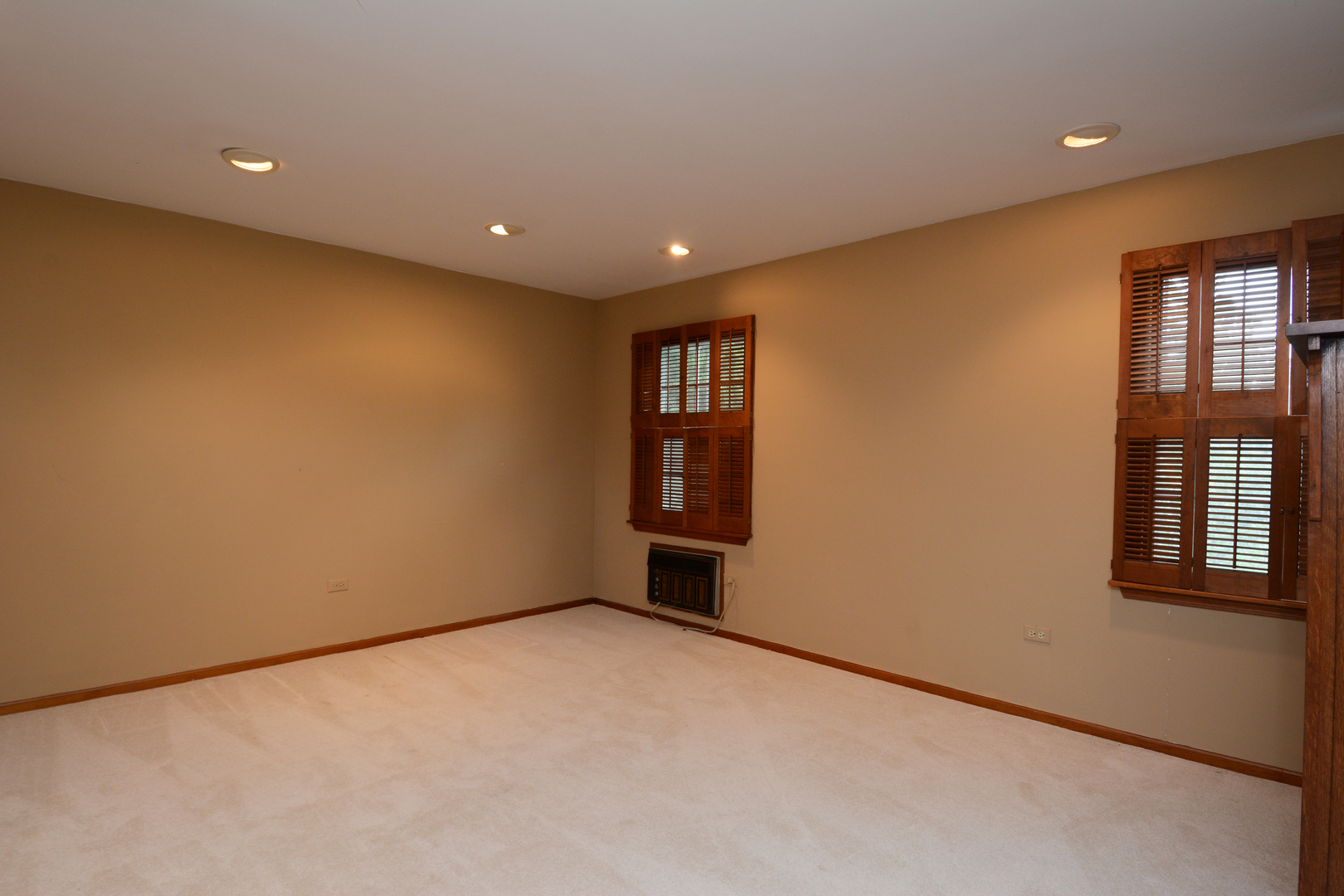 216 Blackhawk Road Riverside, IL 60546 - Photo 17 of 27 a view of an empty room with windows & cabinet