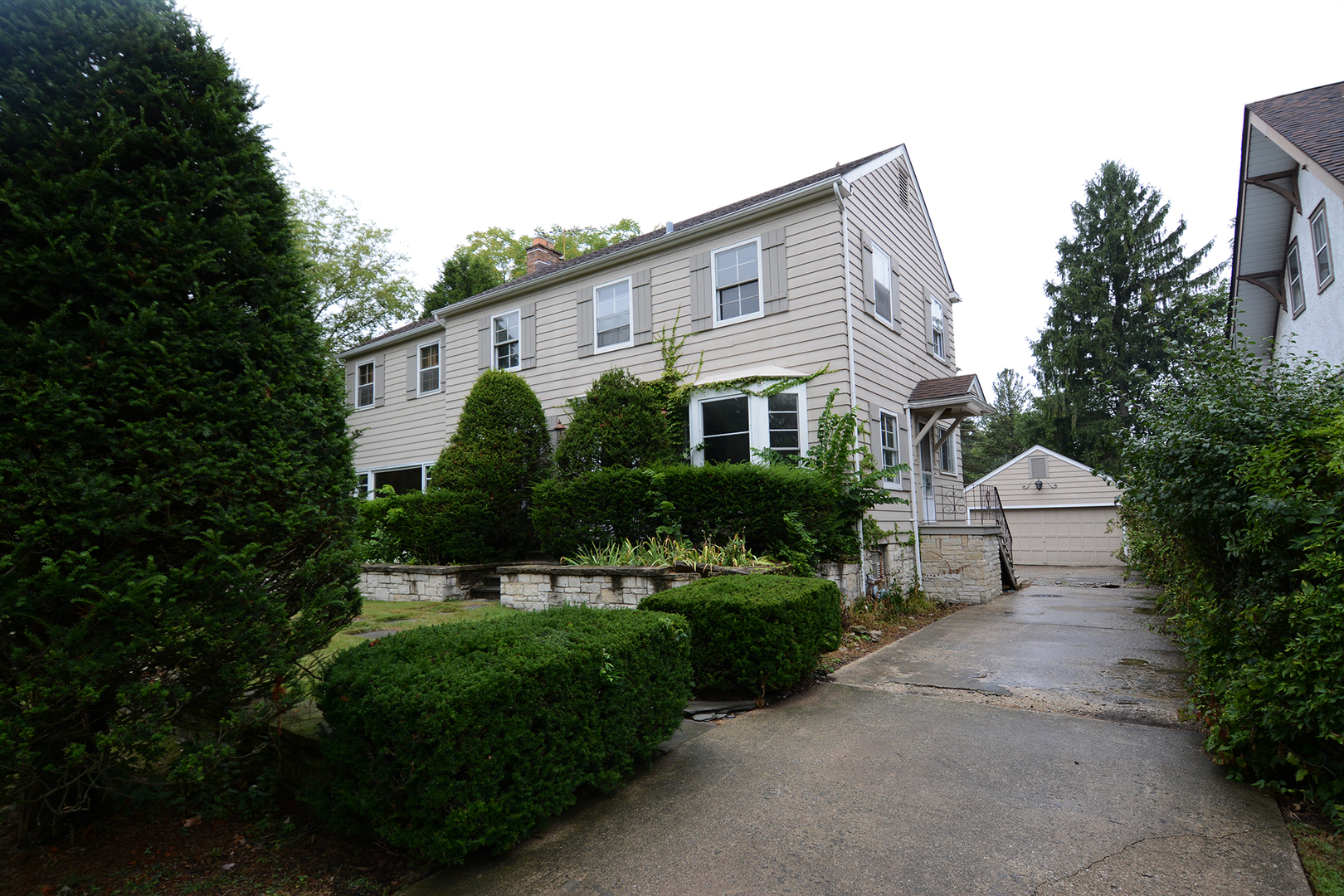 216 Blackhawk Road Riverside, IL 60546 - Photo 22 of 27 a front view of a house with a garden