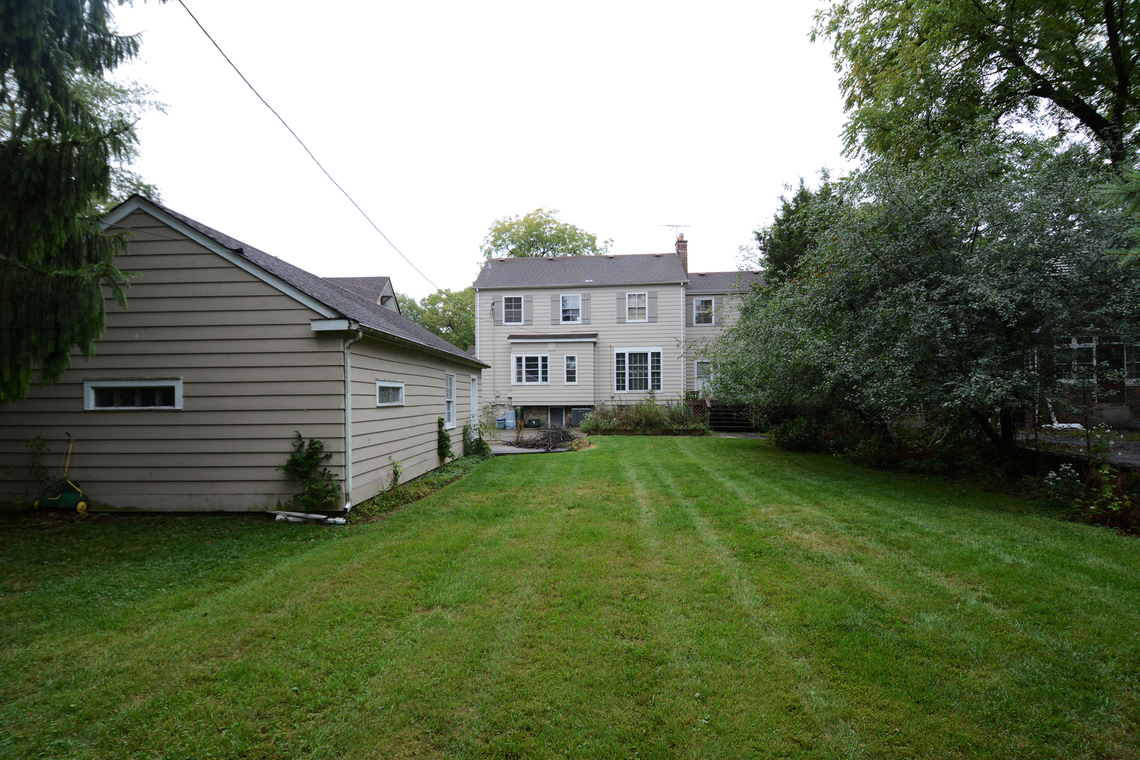 216 Blackhawk Road Riverside, IL 60546 - Photo 25 of 27 a view of a house with a backyard