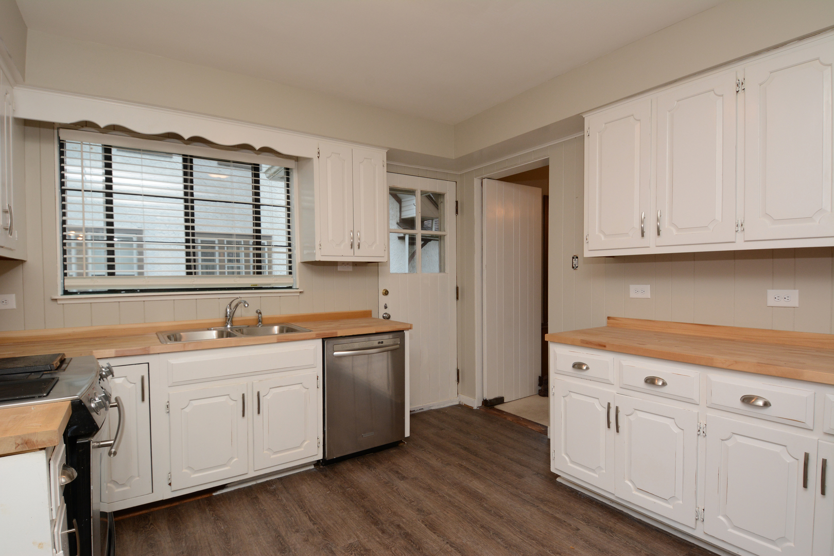 216 Blackhawk Road Riverside, IL 60546 - Photo 8 of 27 a kitchen with stainless steel appliances granite countertop a sink a stove a refrigerator and cabinets
