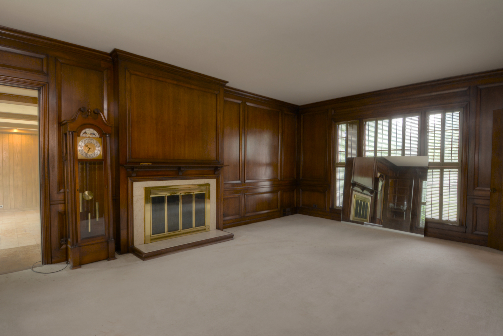 216 Blackhawk Road Riverside, IL 60546 - Photo 9 of 27 a view of an empty room with a fireplace and a window