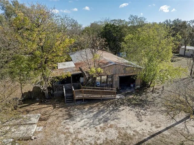 an aerial view of residential house with outdoor space
