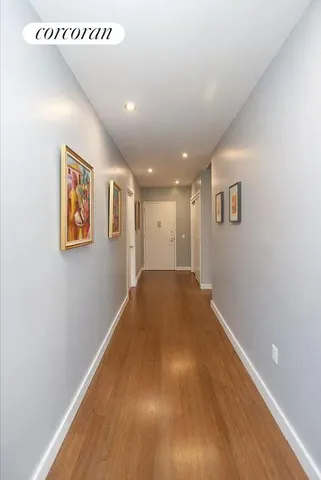 a living room with furniture a rug and a window