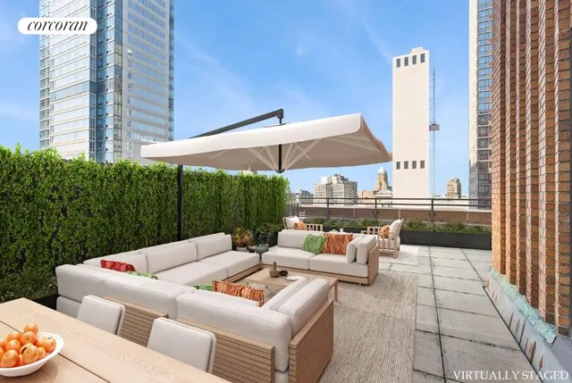 a view of a patio with couches and a table and chairs