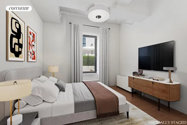 a bedroom with a bed and a painting on the wall