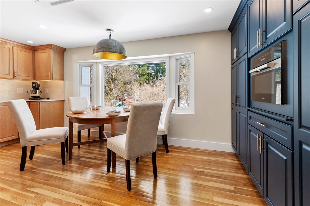 1 Maureen Road Lexington, MA 02420 - Photo 14 of 40 a view of a dining room with furniture window and wooden floor