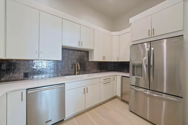 a living room with fireplace furniture and a flat screen tv