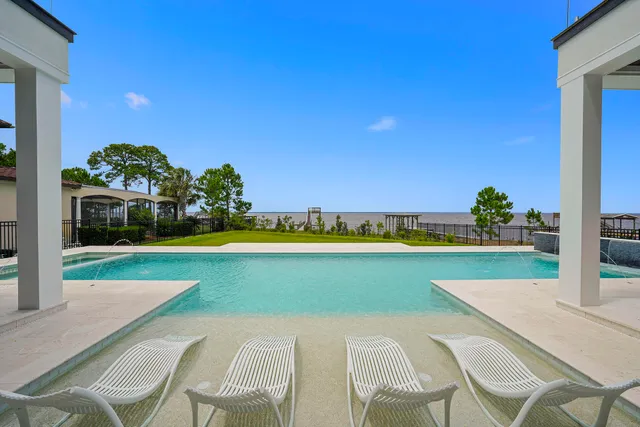 a bedroom with a bed and a mirror